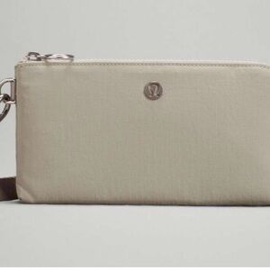 Lululemon Cream Curved Wristlet